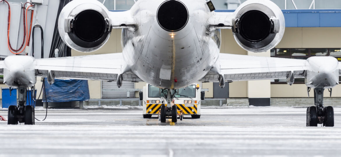 View of the engines and tail of the aircraft when push back at the airport.