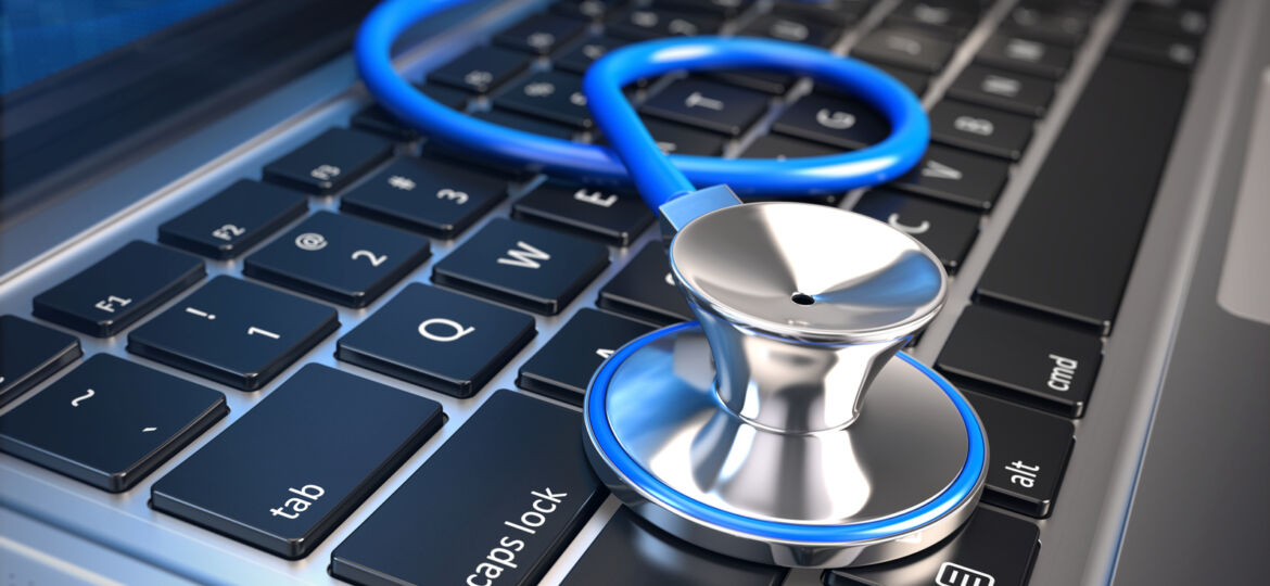 stethoscope on laptop keyboard